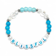 Handmade by Erika Liesel Blissful stretch bracelet with blue crystal glass beads and sterling silver accents.