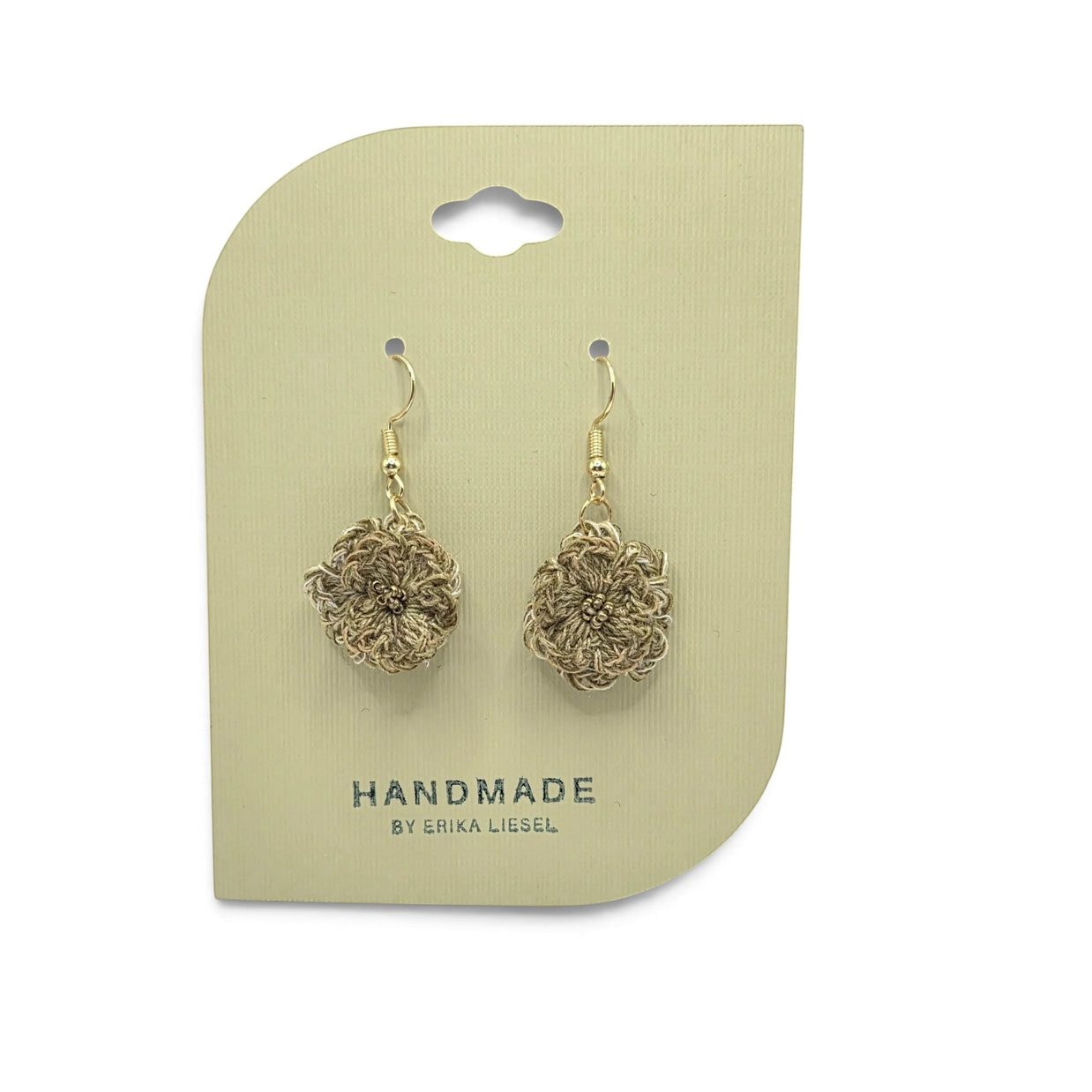 Handmade by Erika Liesel Bloom crochet earrings in beige with intricate bead details and gold-tone hooks.
