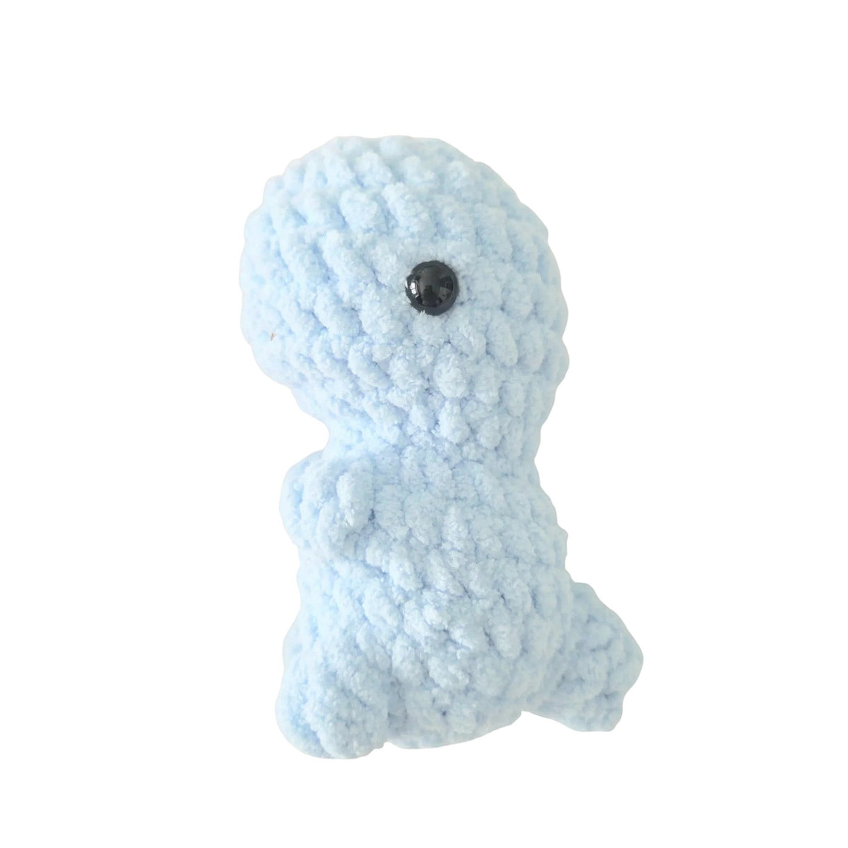 Handmade by Erika Liesel light blue crochet dinosaur plushie made from soft chenille yarn with black safety eyes.