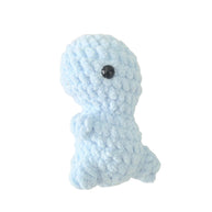 Handmade by Erika Liesel light blue crochet dinosaur plushie made from soft chenille yarn with black safety eyes.