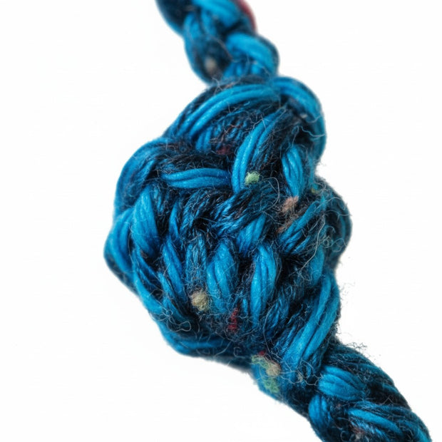 Handmade by Erika Liesel blue crochet garland featuring a detailed knotted texture on soft yarn.