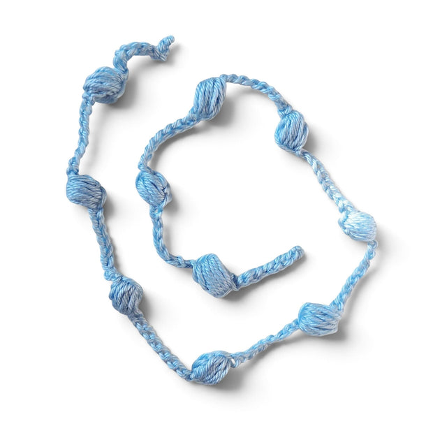 Handmade by Erika Liesel light blue crochet garland with textured knotted details for cozy home decor