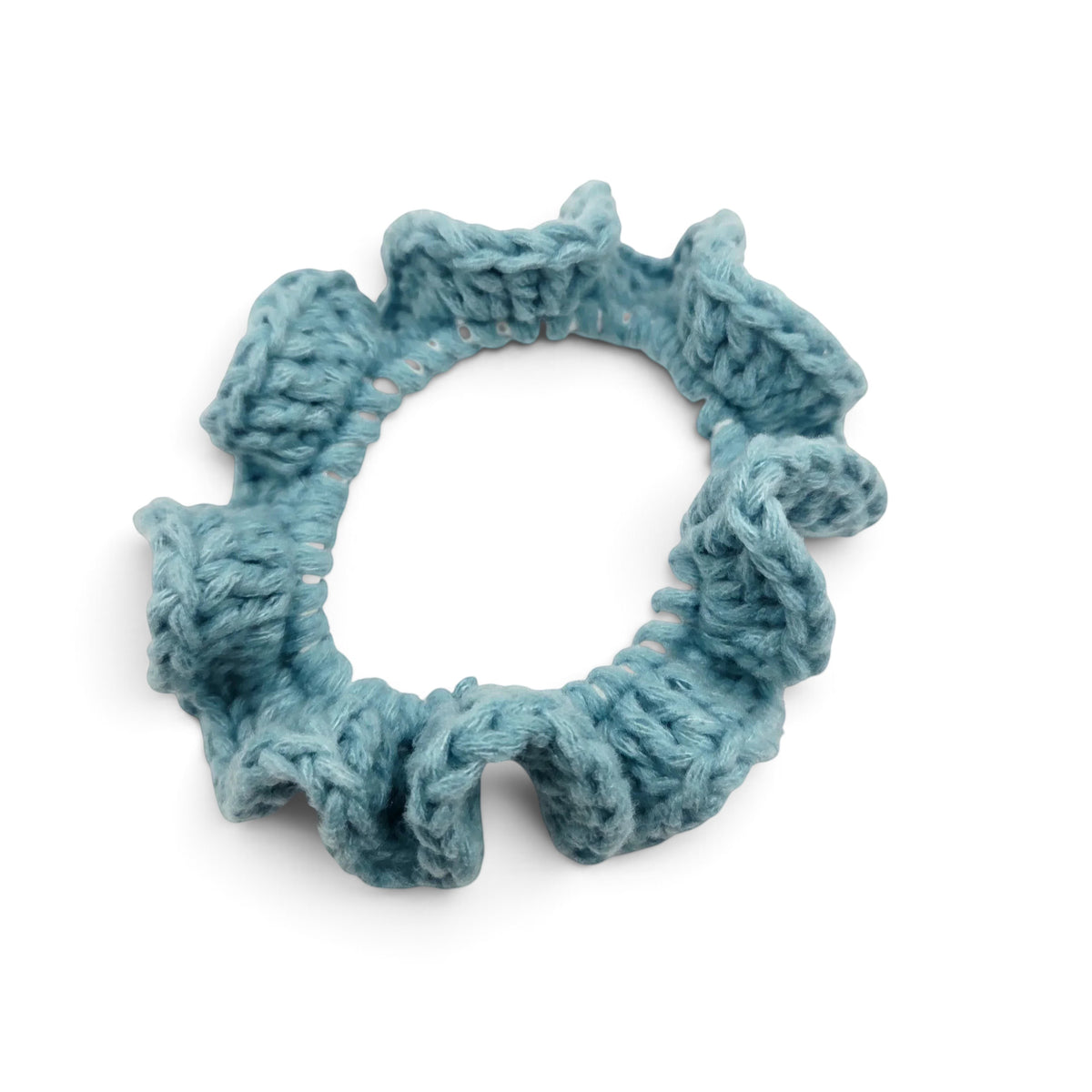 Handmade by Erika Liesel light blue crochet scrunchie with a soft, textured yarn finish for a gentle hair hold.