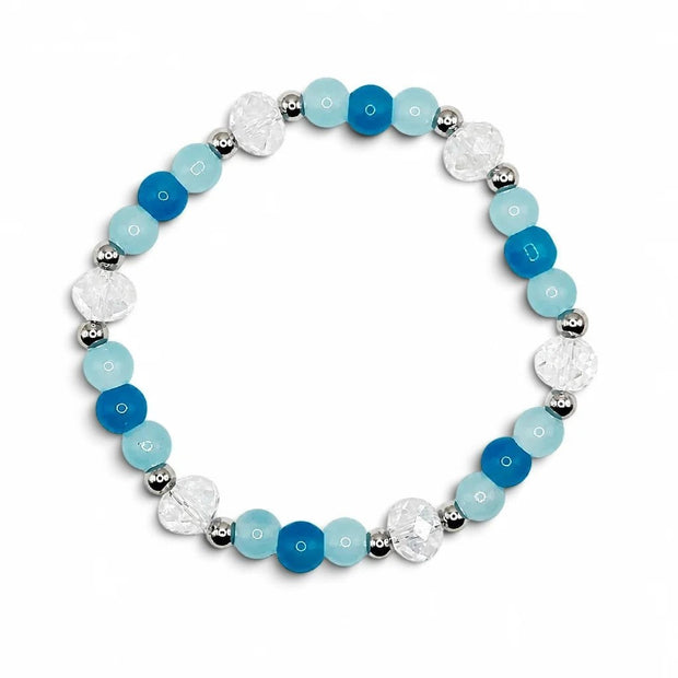 Handmade by Erika Liesel Horizon stretch bracelet featuring blue crystal beads and sterling silver accents.