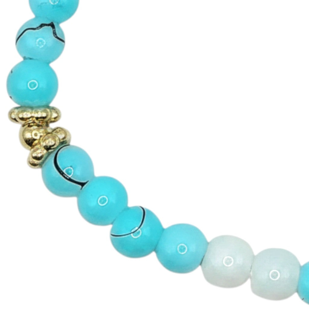 Handmade by Erika Liesel Blue Current stretch bracelet featuring aqua marbled glass beads and gold-tone accents.