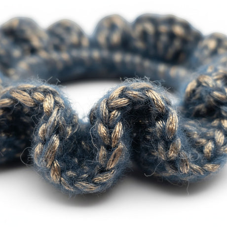Handmade by Erika Liesel Luxe Touch crochet scrunchie in blue and metallic gold yarn with a soft textured finish.
