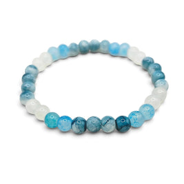 Handmade by Erika Liesel Blue Horizon stretch bracelet featuring marbled pale blue, icy white, and deep blue glass beads