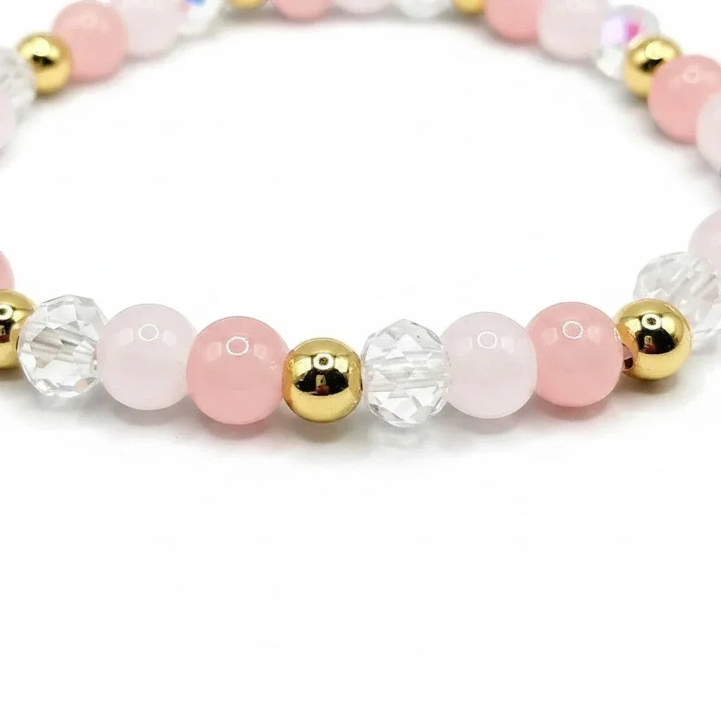 Handmade by Erika Liesel blush pink glass bead bracelet with clear crystal accents and 18K gold-plated details.