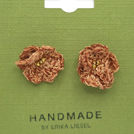Handmade by Erika Liesel brown crochet flower stud earrings with gold bead centers on a green display card.