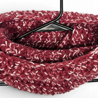 Handmade by Erika Liesel crochet neck warmer in a textured burgundy and white marled yarn on a black hanger.