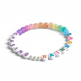 Handmade by Erika Liesel Chasing Rainbows elastic bracelet with colorful glass beads and white pearl accents.