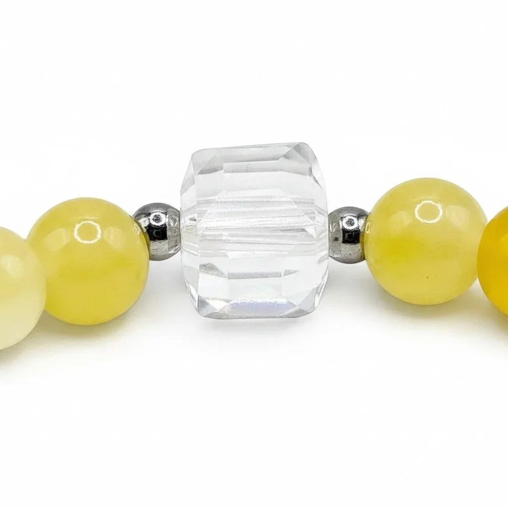 Handmade by Erika Liesel citrine bracelet featuring sunny yellow glass beads, faceted crystal, and silver accents.