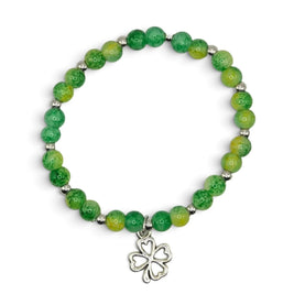 Handmade by Erika Liesel green and yellow glass bead stretch bracelet with a silver four-leaf clover charm