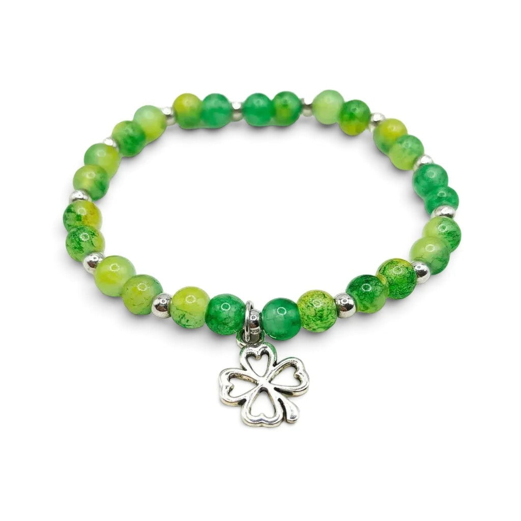 Handmade by Erika Liesel green and yellow glass bead stretch bracelet featuring a silver four-leaf clover charm.