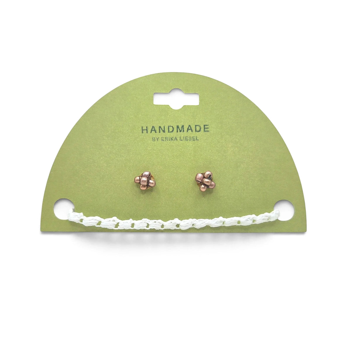Handmade copper stud earrings with white crochet chain on green card, cozy artisan jewelry gift