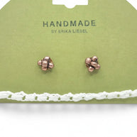 Handmade by Erika Liesel cluster stud earrings in copper tone displayed on a green card with a white crochet trim