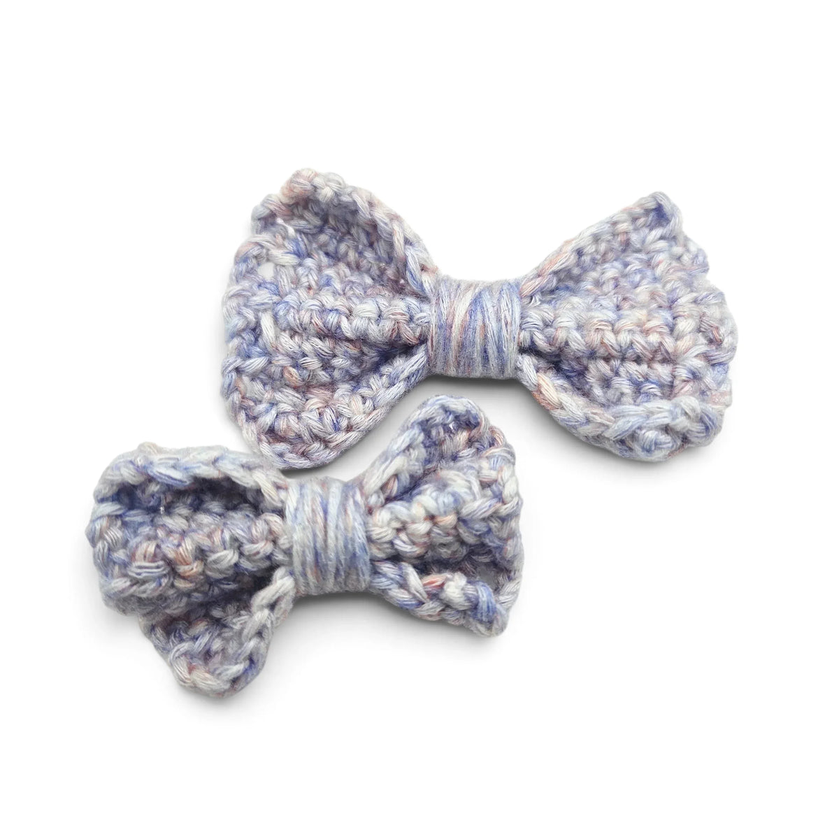 Handmade by Erika Liesel crochet bow barrette set in variegated pastel blue and purple yarn on alligator clips.