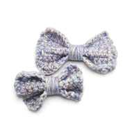 Handmade by Erika Liesel crochet bow barrette set in variegated pastel blue and purple yarn on alligator clips