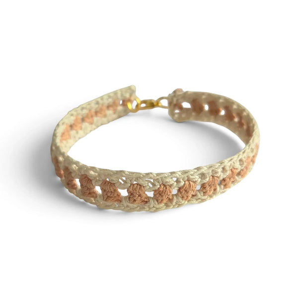 Handmade crochet bracelet with cream and peach pattern, gold clasp, cozy boho accessory