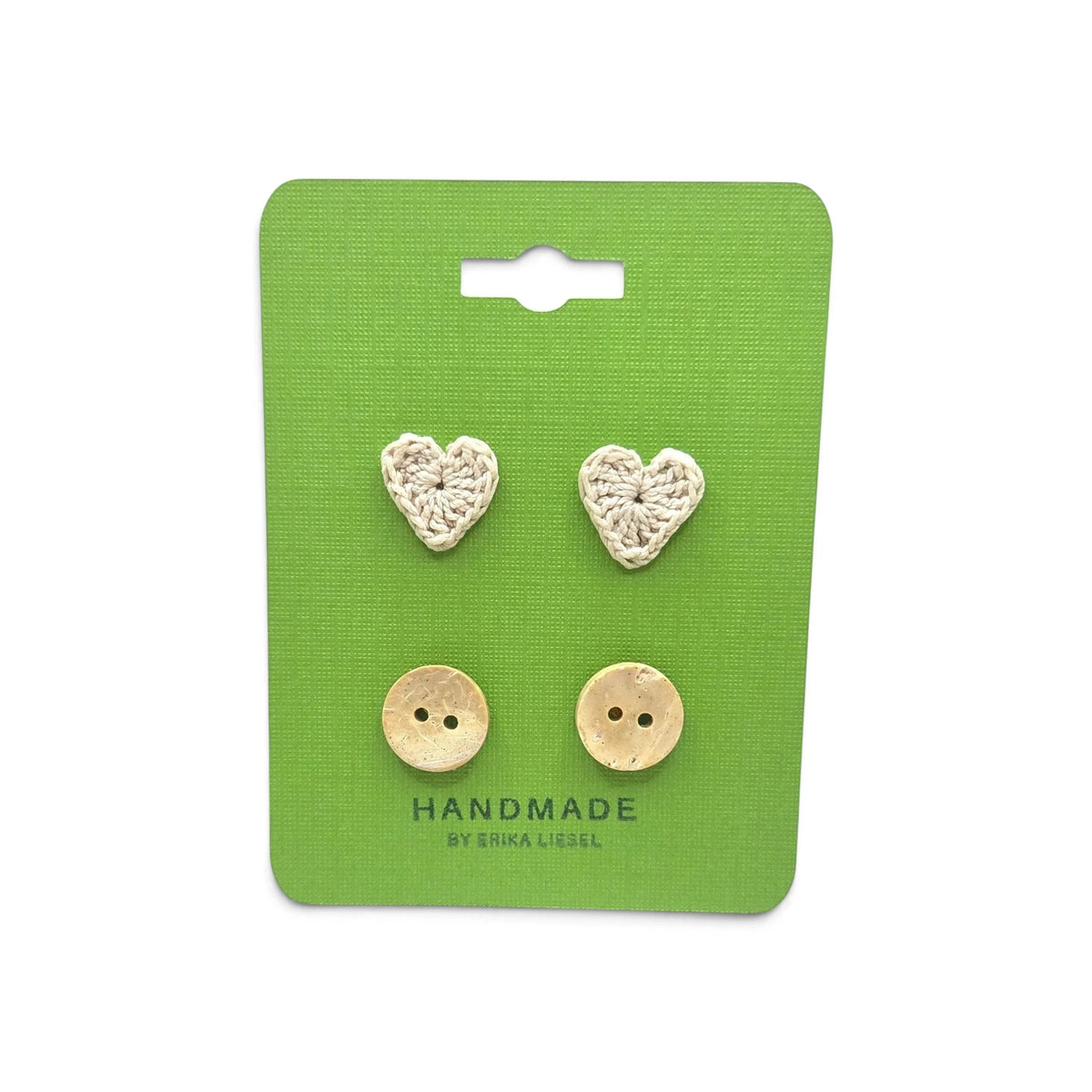 Handmade crochet heart and coconut shell buttons on green card, cozy craft supplies