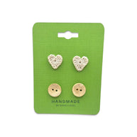 Handmade crochet heart and coconut shell buttons on green card, cozy craft supplies