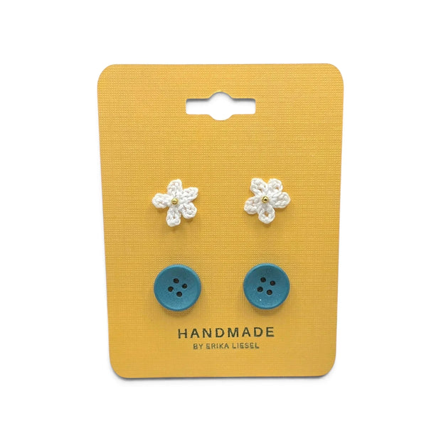 Handmade crochet flower and blue button earrings on yellow card, cozy craft gift