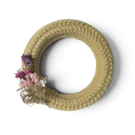 Handmade by Erika Liesel crochet floral wreath in neutral beige with dried purple and pink flower accents.