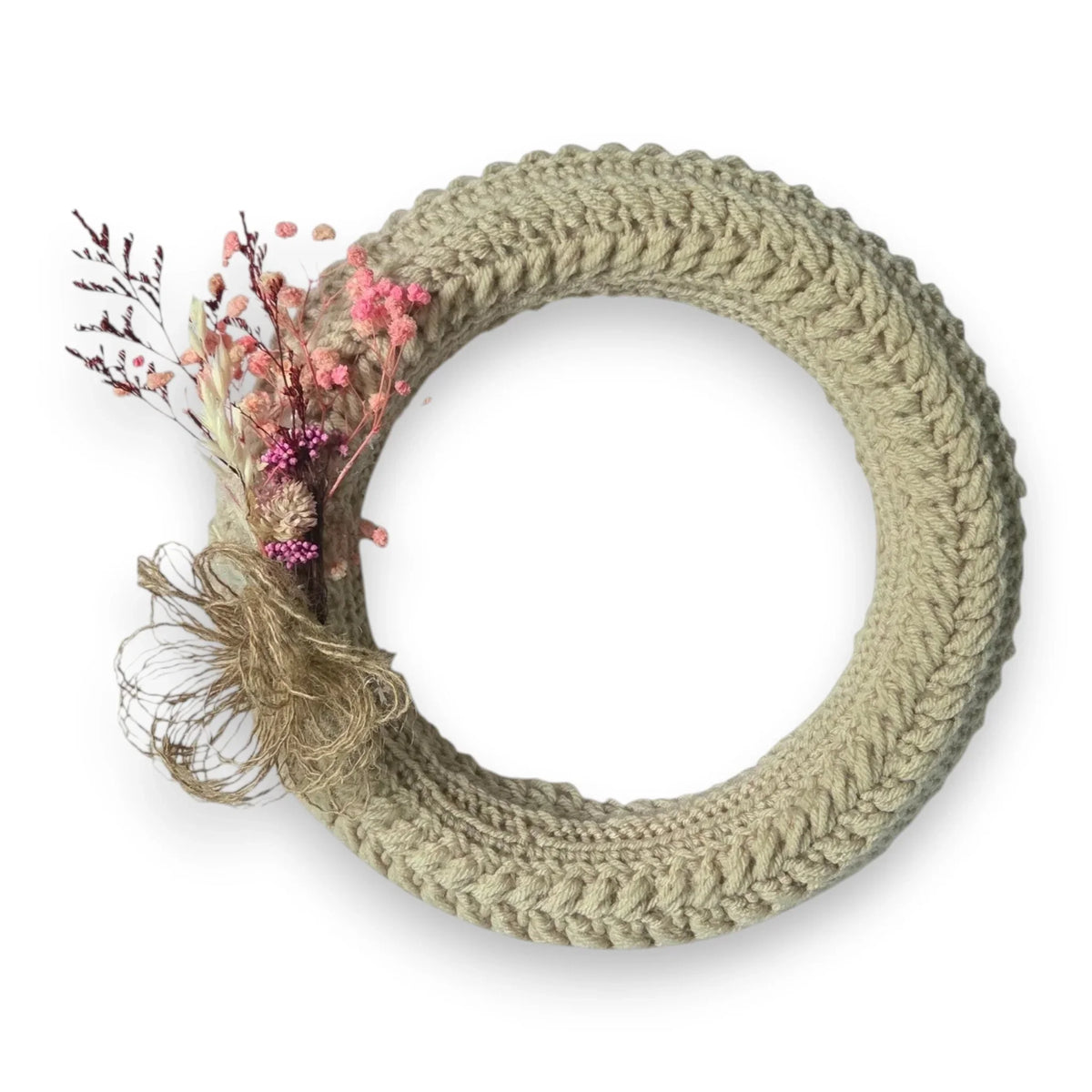 Handmade by Erika Liesel crochet floral wreath in neutral beige with pink dried flower accents and twine detail.