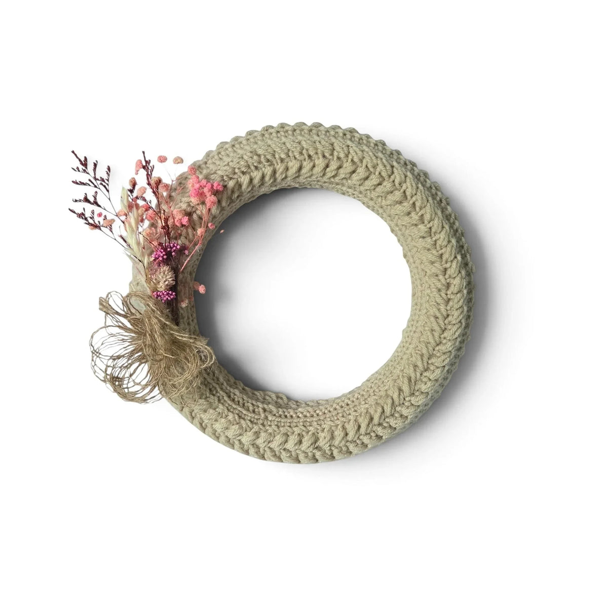 Handmade by Erika Liesel crochet wreath in neutral beige with delicate pink and purple dried floral accents