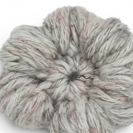 Handmade by Erika Liesel crochet flower barrette in grey and soft pink yarn with a textured, handcrafted finish.