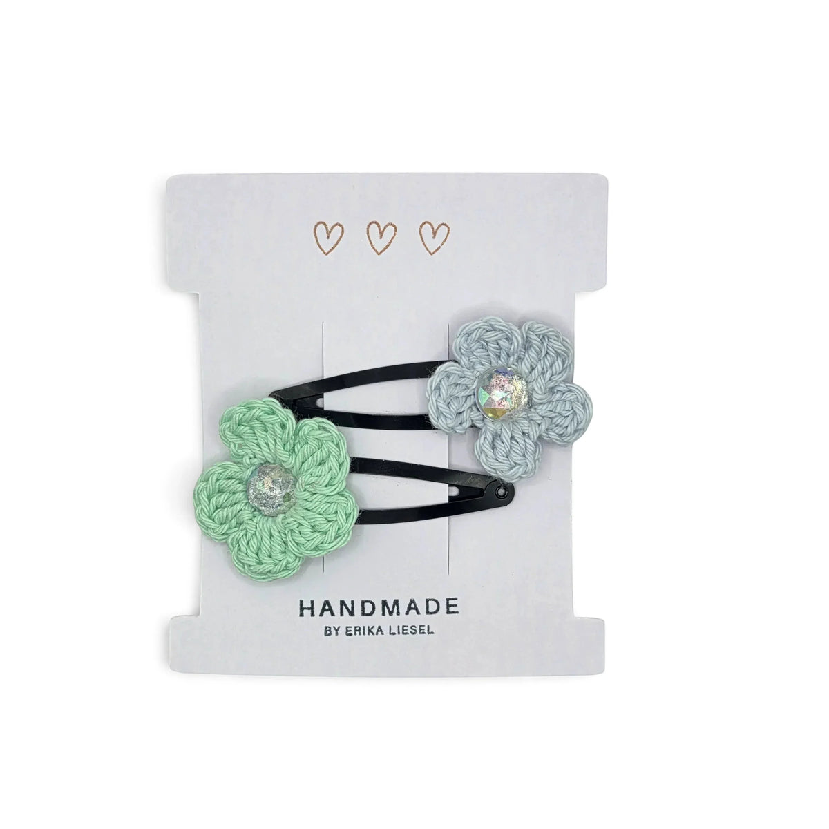 Handmade by Erika Liesel crochet flower snap clips in mint and light blue with sparkling rhinestone centers.