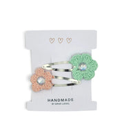 Handmade by Erika Liesel crochet flower snap clips in peach and mint green with sparkling rhinestone centers.