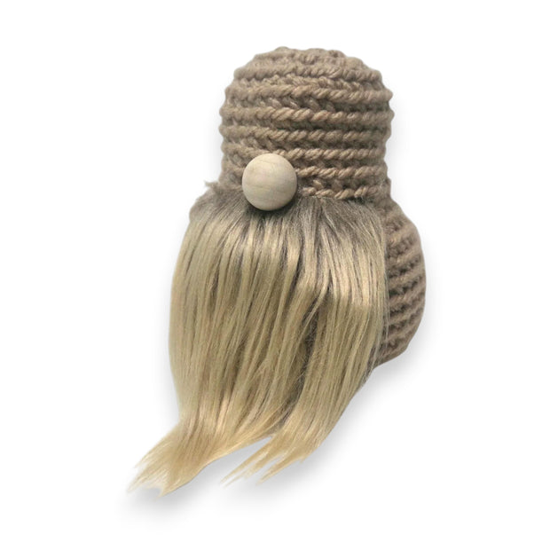 Handmade by Erika Liesel crochet gnome base with a neutral yarn body, wooden nose, and soft faux fur beard.