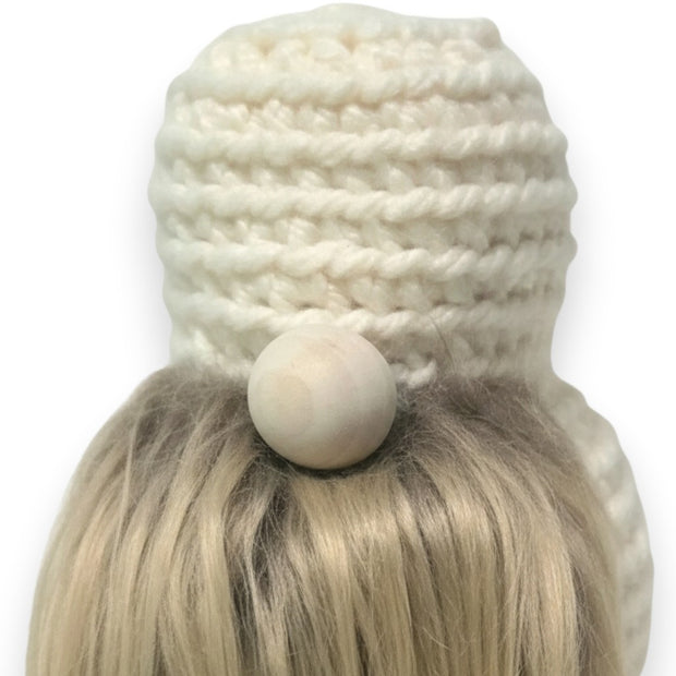 Handmade by Erika Liesel crochet gnome base with a cream yarn body, wooden nose, and soft faux fur beard.