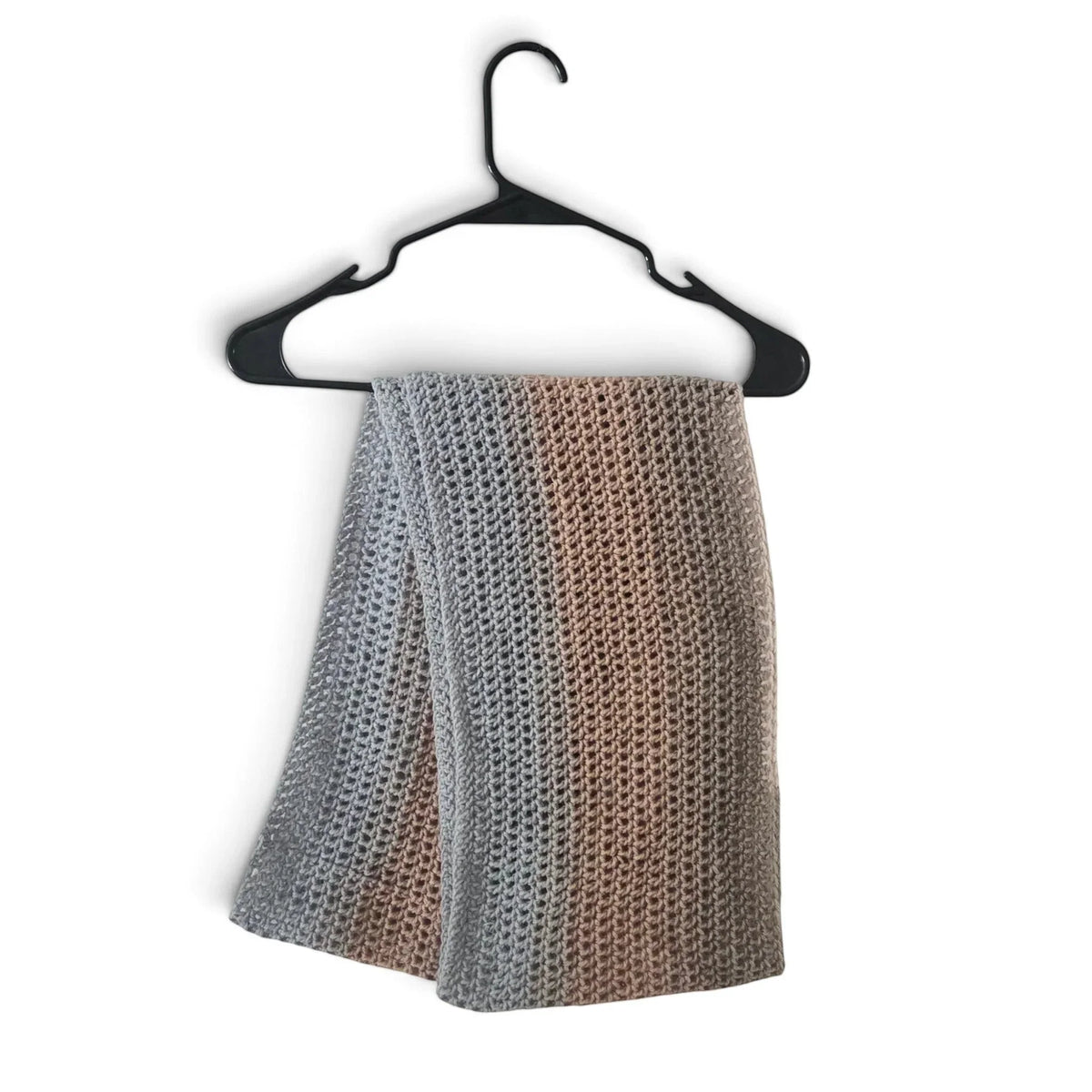 Handmade by Erika Liesel crochet infinity scarf in a soft grey and tan striped acrylic blend on a black hanger.