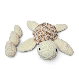 Handmade by Erika Liesel crochet turtle plushie in cream and brown with three removable matching eggs