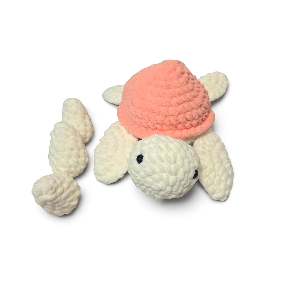 Handmade by Erika Liesel crochet turtle plushie with a soft peach shell and cream body, including three matching eggs.