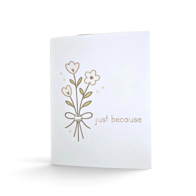 Handmade by Erika Liesel floral greeting card with glitter pen accents and a central gemstone detail.