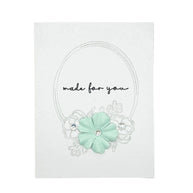 Handmade by Erika Liesel greeting card with a hand-drawn floral frame and mint green paper flower embellishment.