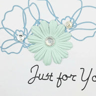 Handmade by Erika Liesel floral greeting card featuring a mint paper flower, blue line art, and crystal accents.