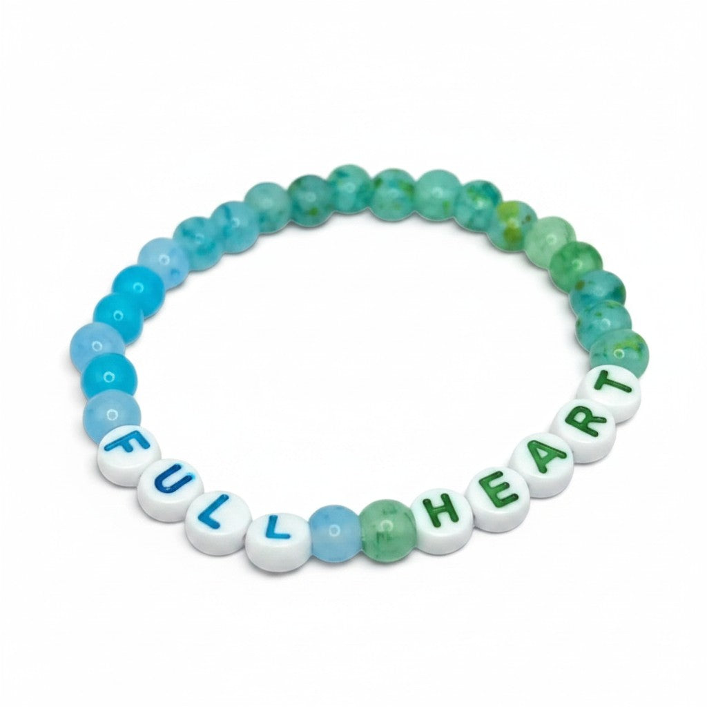 Handmade by Erika Liesel Full Heart stretch bracelet with blue, aqua, and green glass beads and lettered acrylic beads.