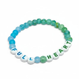 Handmade by Erika Liesel Full Heart stretch bracelet with blue, aqua, and green glass beads and lettered acrylic beads.