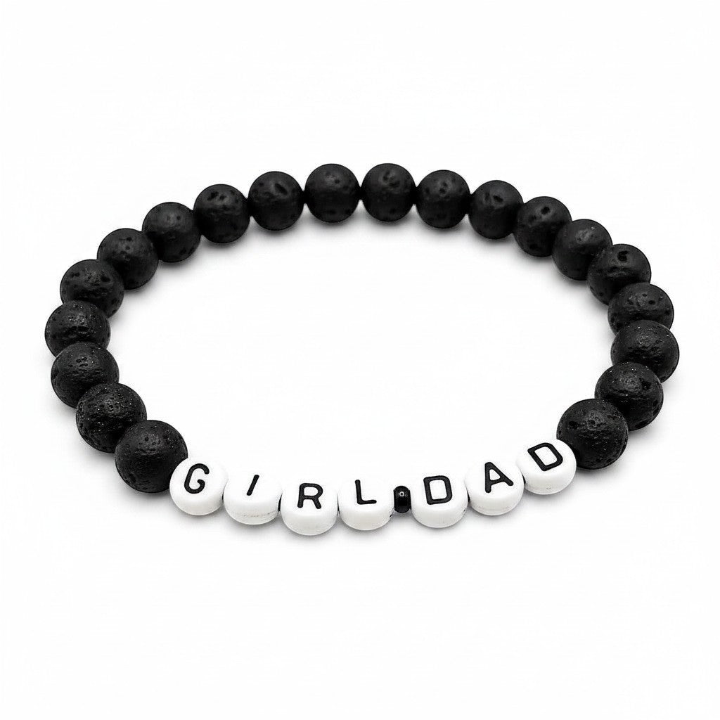 Handmade by Erika Liesel men's stretch bracelet featuring matte black lava stone beads and white Girl Dad letter beads.
