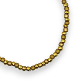 Handmade by Erika Liesel Golden Sand stretch bracelet featuring small matte gold glass beads on elastic cord.