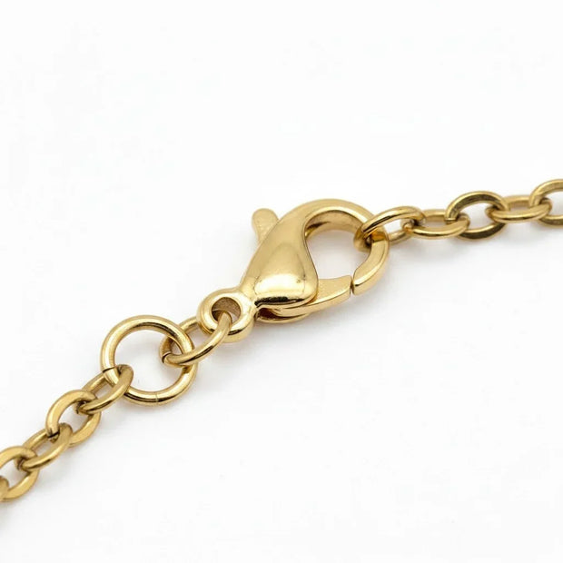 Handmade by Erika Liesel gold tone stainless steel oval cable chain bracelet featuring a secure lobster clasp