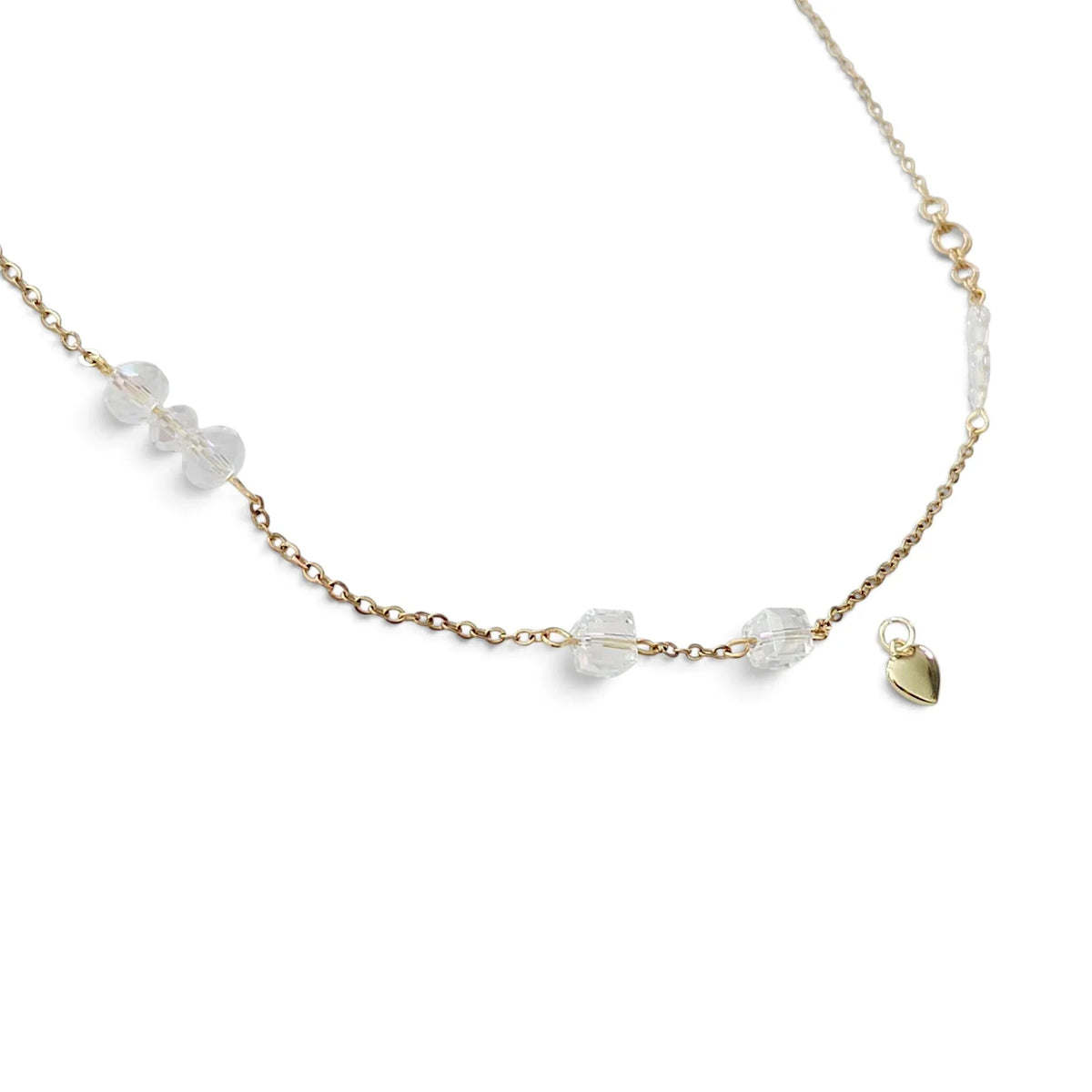 Handmade by Erika Liesel 24-inch gold-tone chain necklace with clear crystal glass accents and a small heart charm.