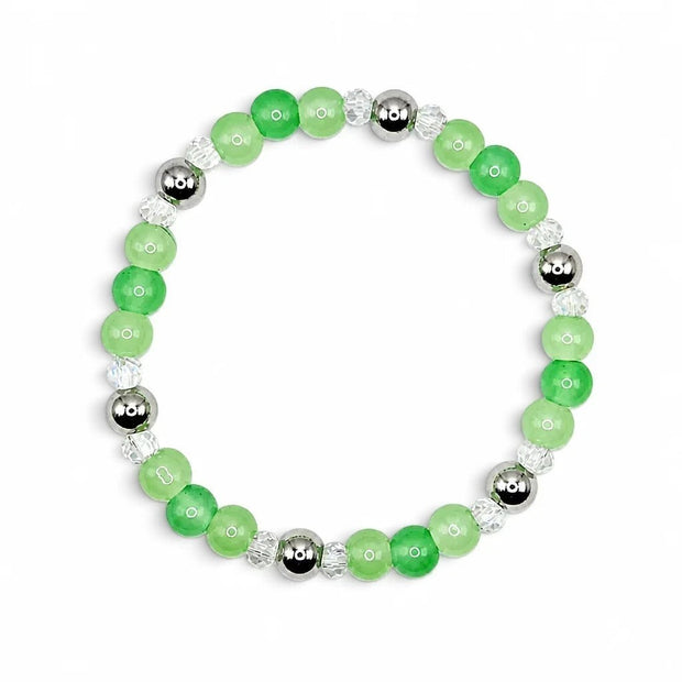 Handmade by Erika Liesel Meadow stretch bracelet featuring green glass beads, clear crystals, and silver-tone accents.