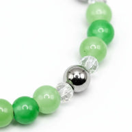 Handmade by Erika Liesel Meadow stretch bracelet featuring green glass beads, clear crystals, and silver-tone accents.