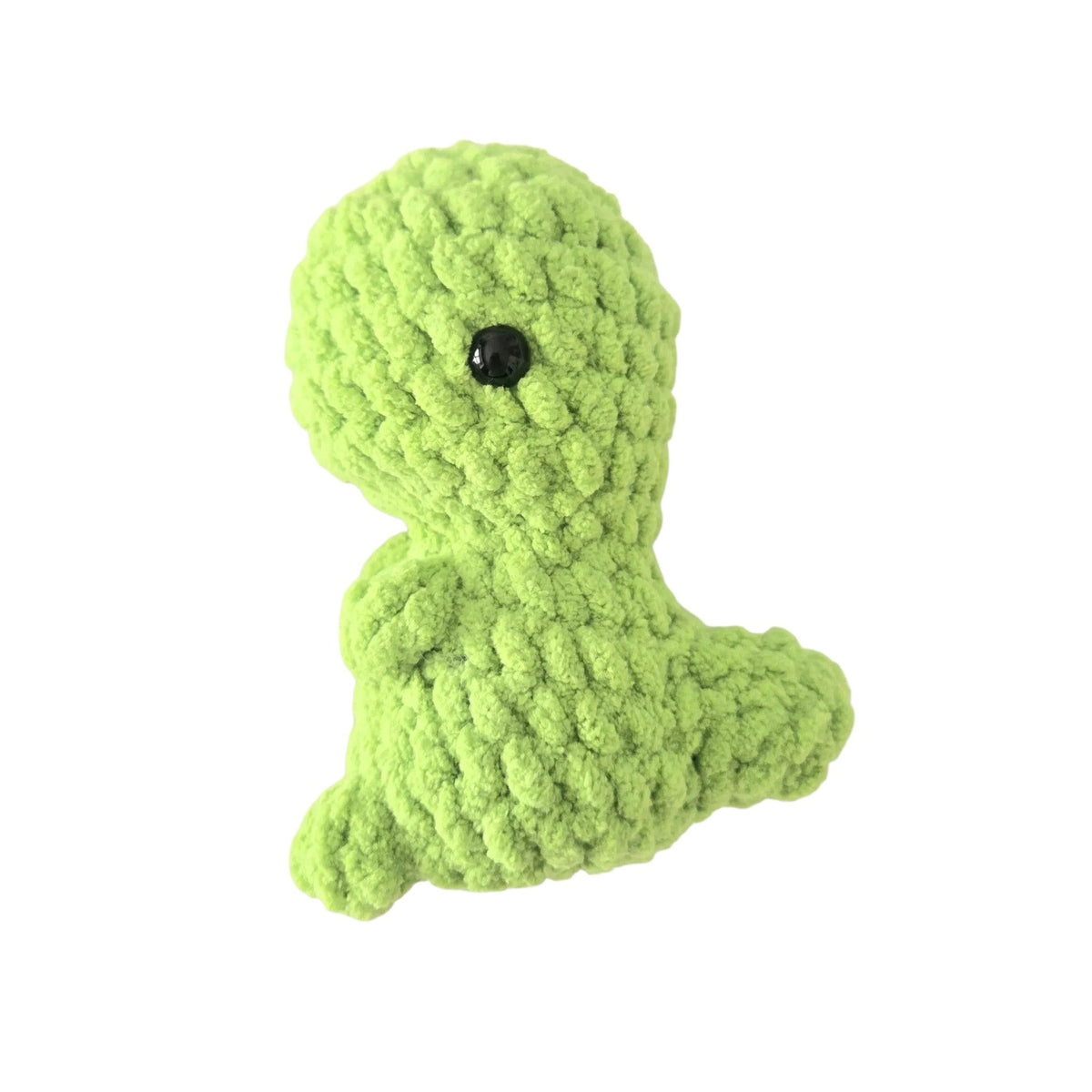 Handmade by Erika Liesel green crochet dinosaur plushie made from soft chenille yarn with a black safety eye.