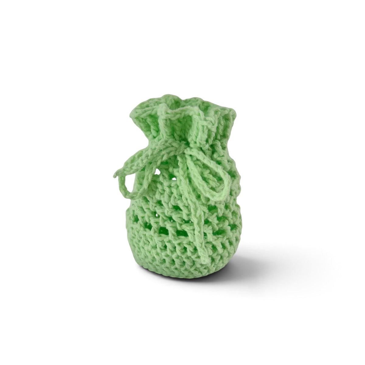 Handmade by Erika Liesel light green crochet drawstring bag made from soft premium yarn for gifts or home storage.